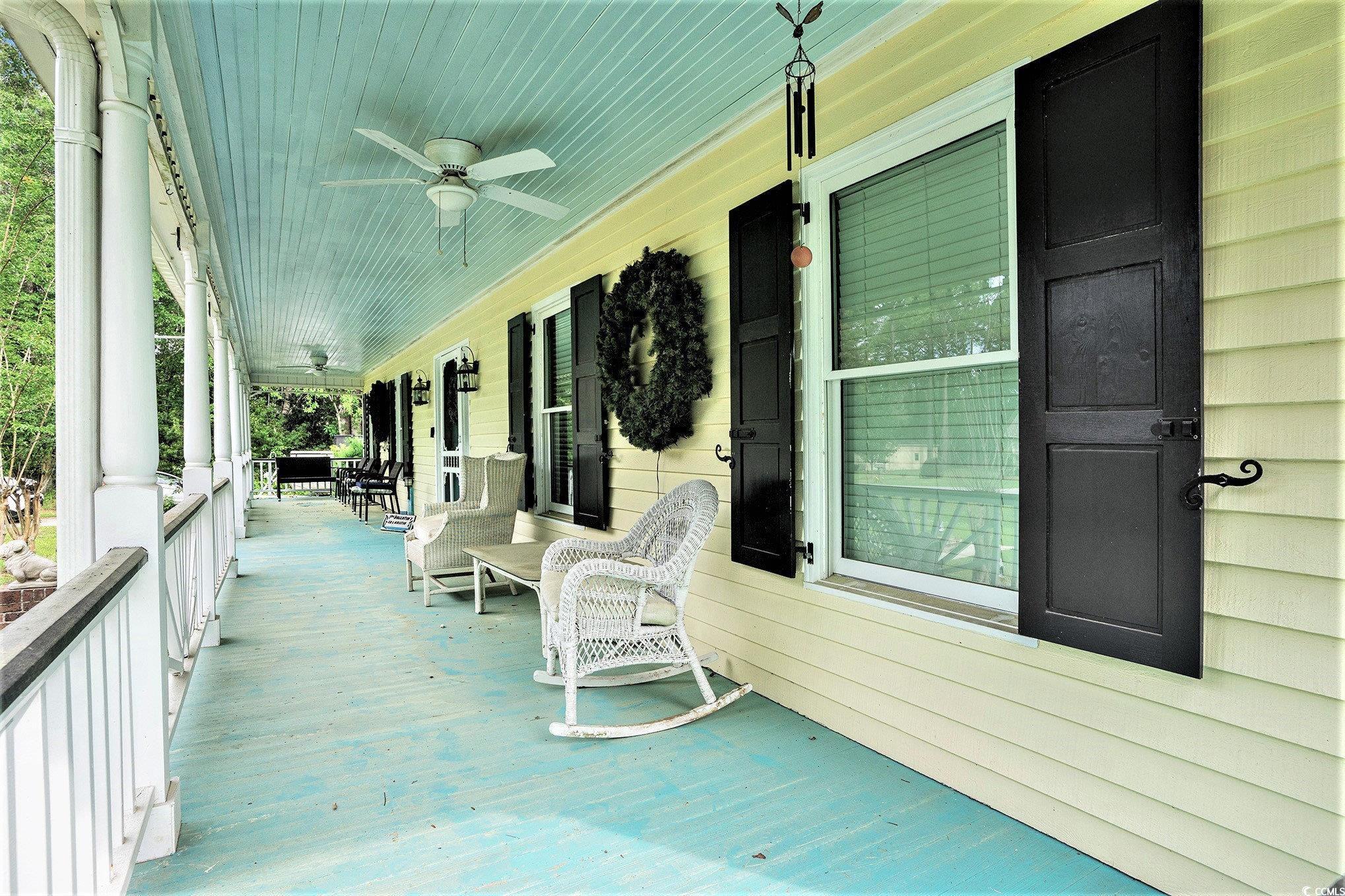 238 Robin Drive Georgetown, SC 29440 - Photo 27 of 31 Deck with covered porch and ceiling fan