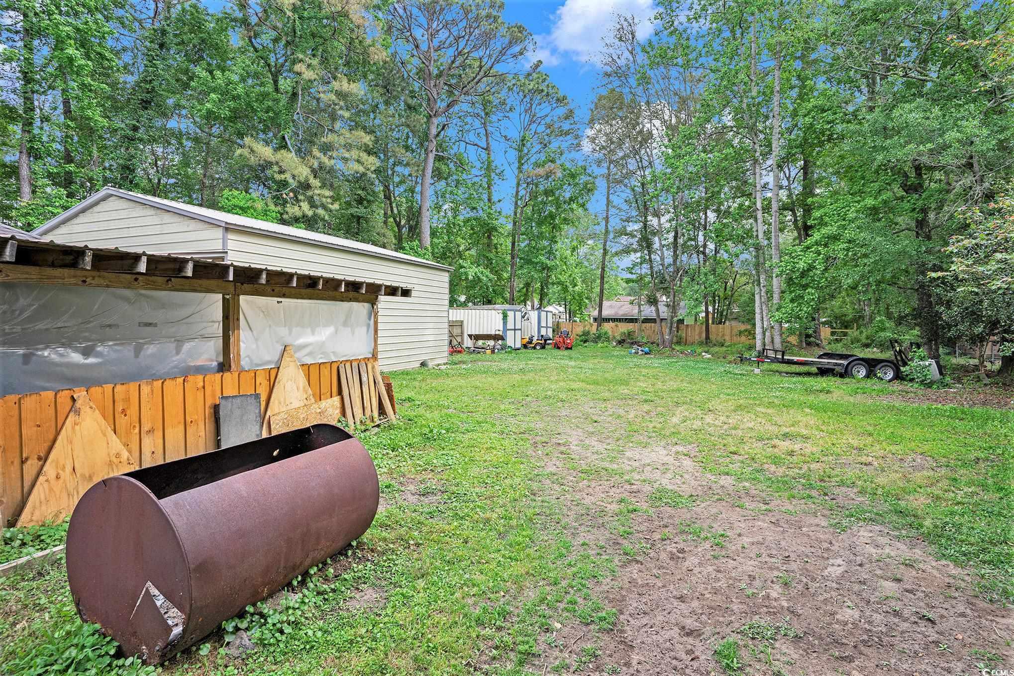 238 Robin Drive Georgetown, SC 29440 - Photo 30 of 31 View of yard with view of wooded area