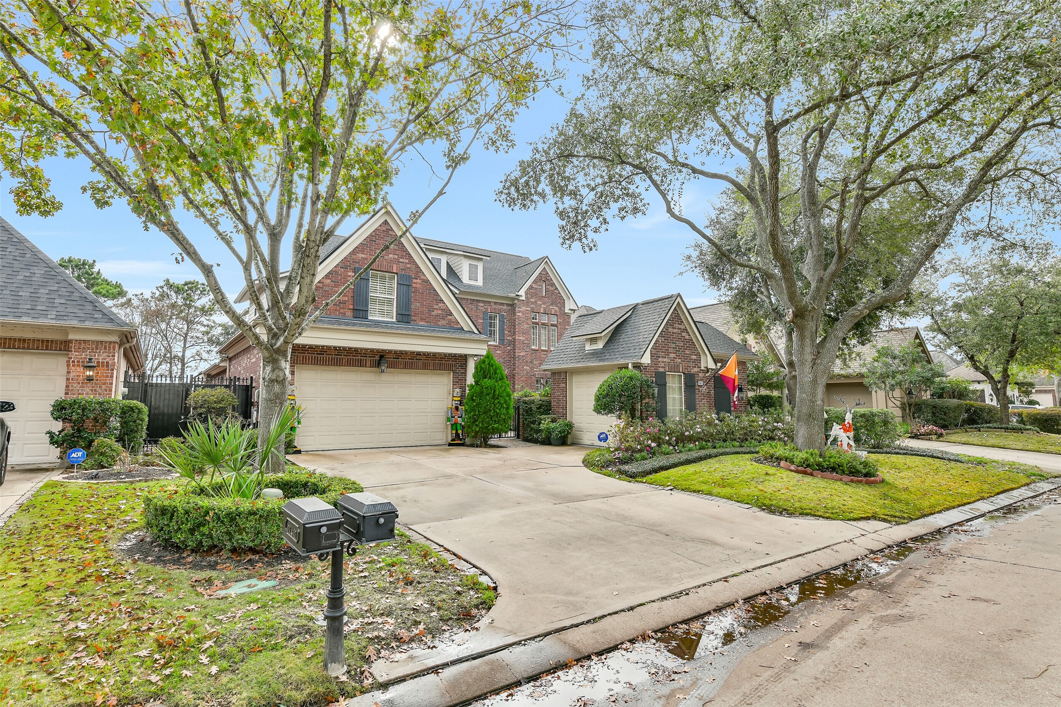 11413 Gallant Ridge Lane Houston, TX 77082 - Photo 5 of 50 Charming two-story brick home with a spacious driveway and attached garage. The property features well-maintained landscaping, mature trees, and a welcoming entrance. Perfect for families seeking a blend of elegance and comfort.