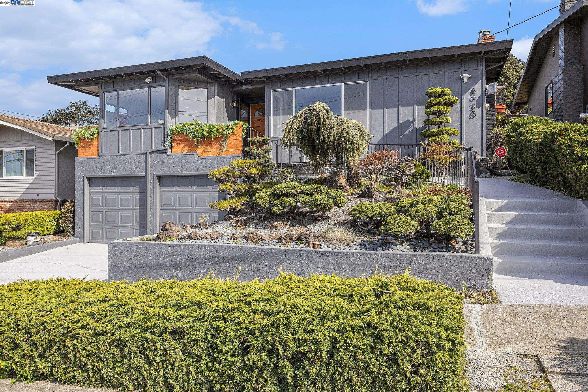 a front view of a house with garden