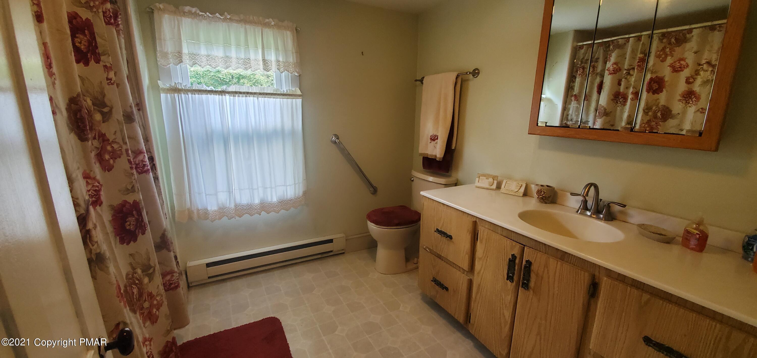 144 Merwinsburg Road Effort, PA 18330 - Photo 27 of 51 a bathroom with a sink and a mirror