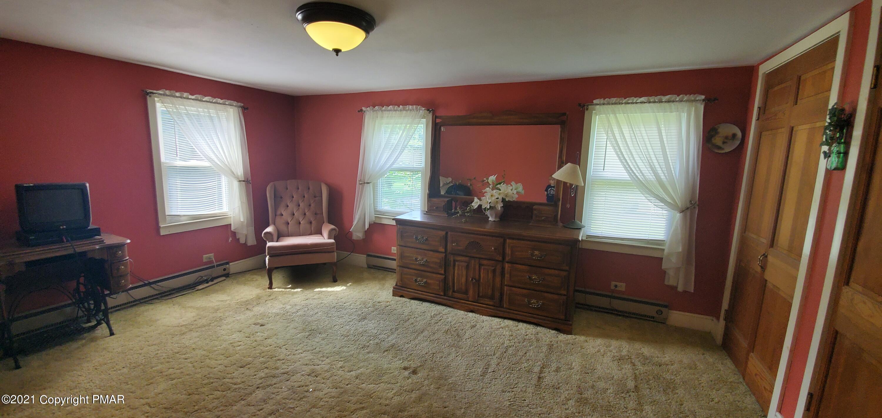 144 Merwinsburg Road Effort, PA 18330 - Photo 30 of 51 a bedroom with a bed and a dresser in it