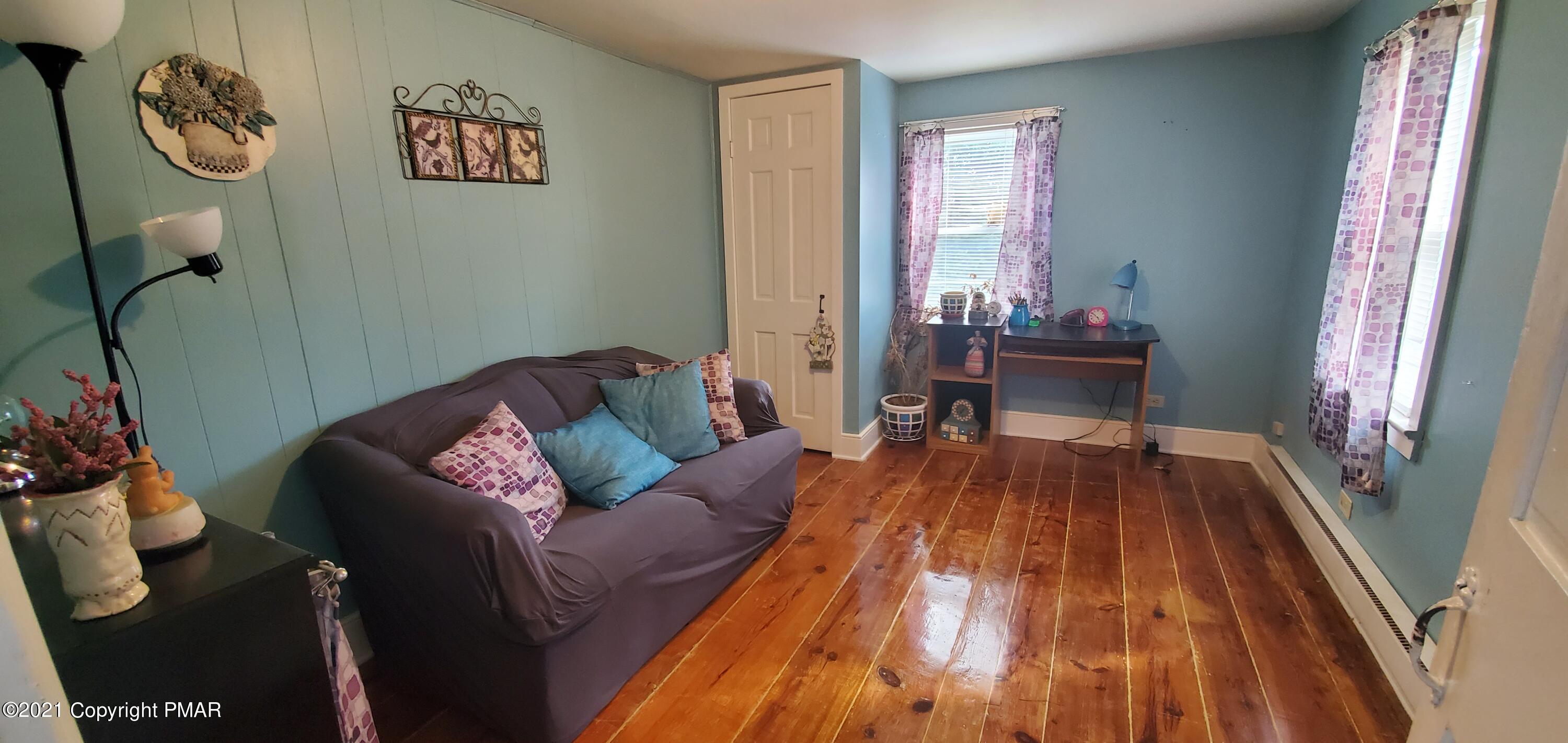 144 Merwinsburg Road Effort, PA 18330 - Photo 34 of 51 a living room with furniture and a wooden floor