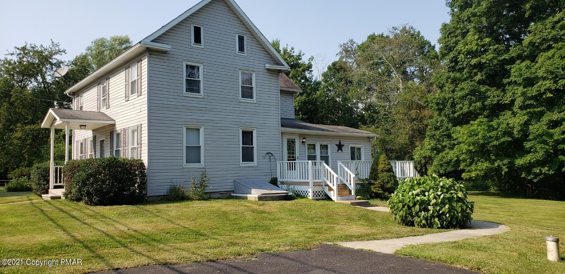 144 Merwinsburg Road Effort, PA 18330 - Photo 4 of 51 a front view of house with yard and trees around