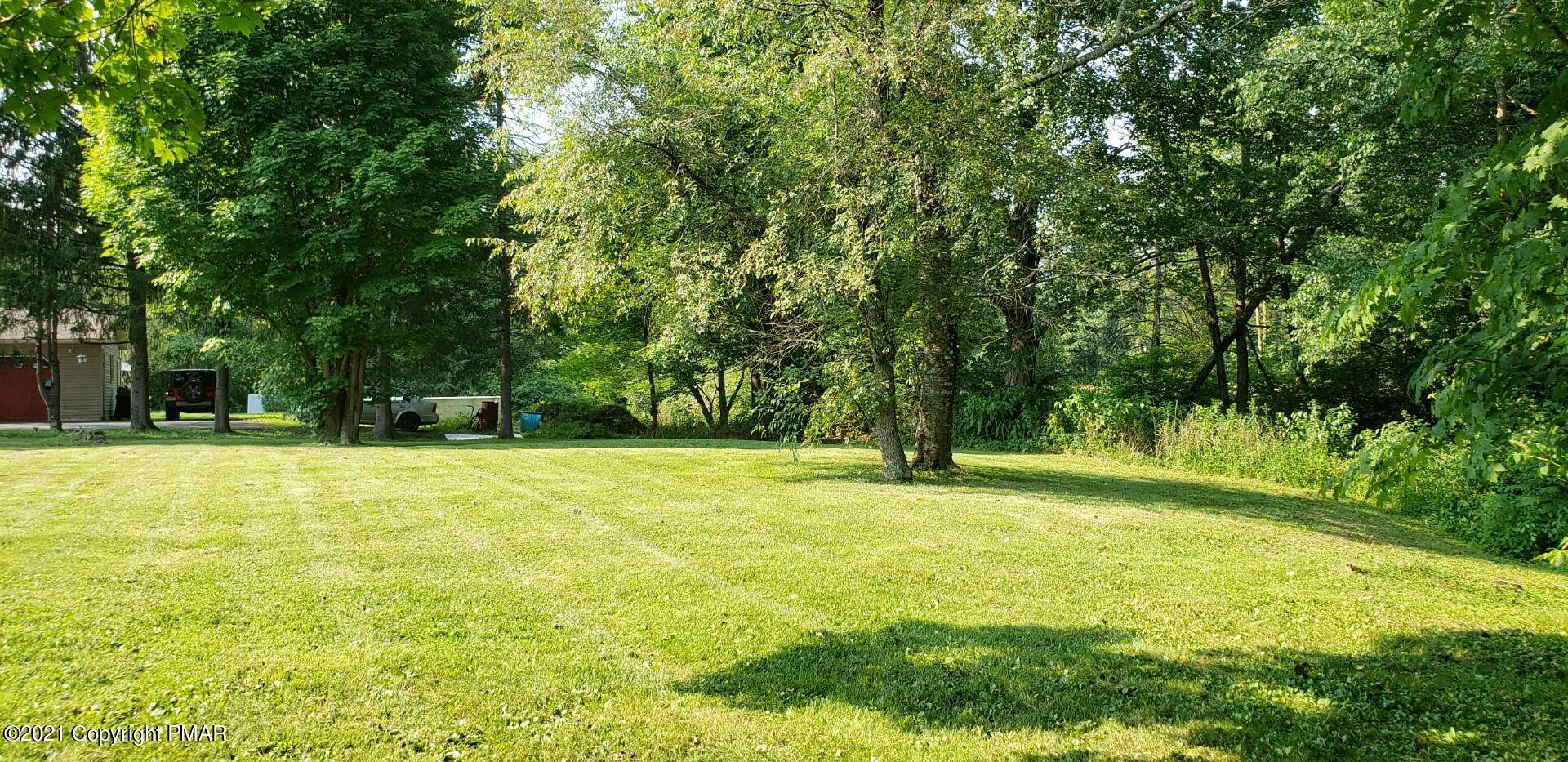 144 Merwinsburg Road Effort, PA 18330 - Photo 41 of 51 a swimming pool with trees in the background