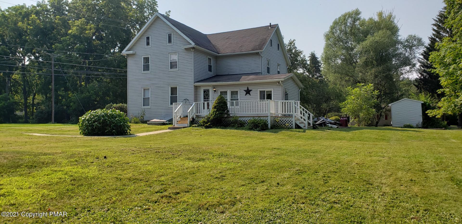 144 Merwinsburg Road Effort, PA 18330 - Photo 5 of 51 a front view of a house with a garden