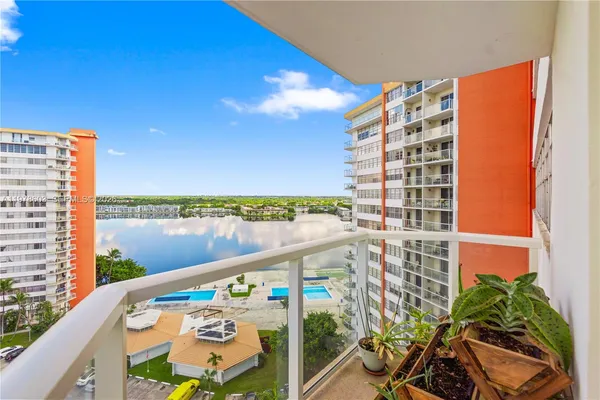 a view of balcony with furniture