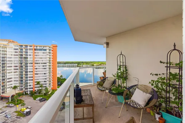 a view of balcony with furniture