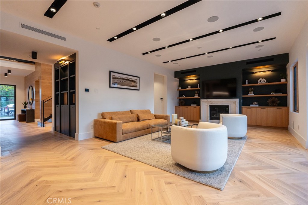 5131 Strohm Avenue Toluca Lake, CA 91601 - Photo 23 of 67 a living room with furniture and a flat screen tv