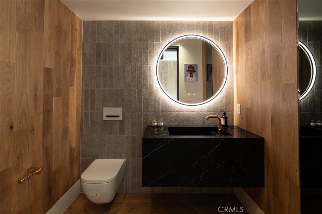 5131 Strohm Avenue Toluca Lake, CA 91601 - Photo 26 of 67 a bathroom with a toilet and a sink