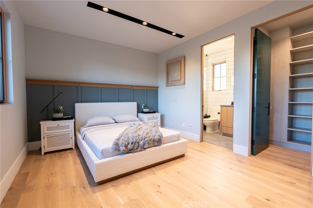 5131 Strohm Avenue Toluca Lake, CA 91601 - Photo 37 of 67 a bedroom with a bed and a flat screen tv