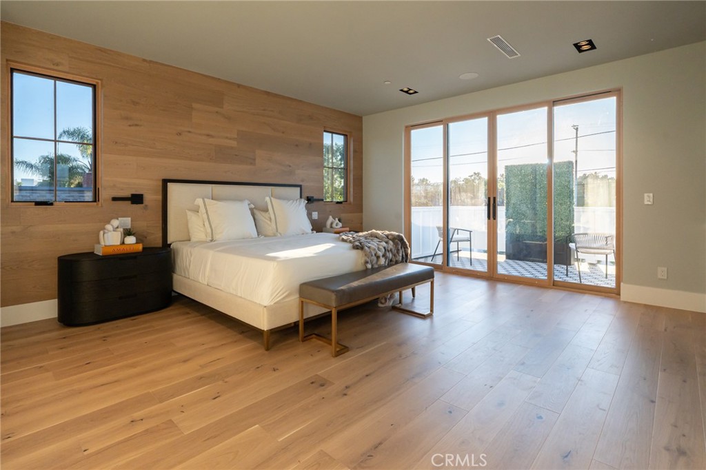 5131 Strohm Avenue Toluca Lake, CA 91601 - Photo 40 of 67 a spacious bedroom with a bed and large window