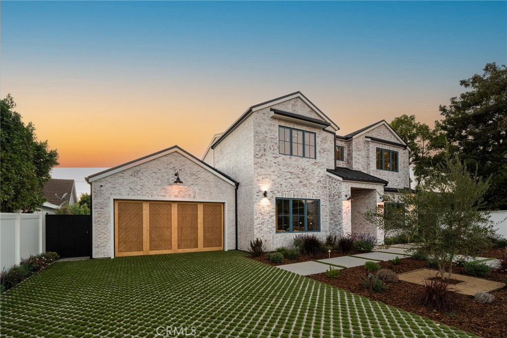 5131 Strohm Avenue Toluca Lake, CA 91601 - Photo 4 of 67 a front view of a house with a garden