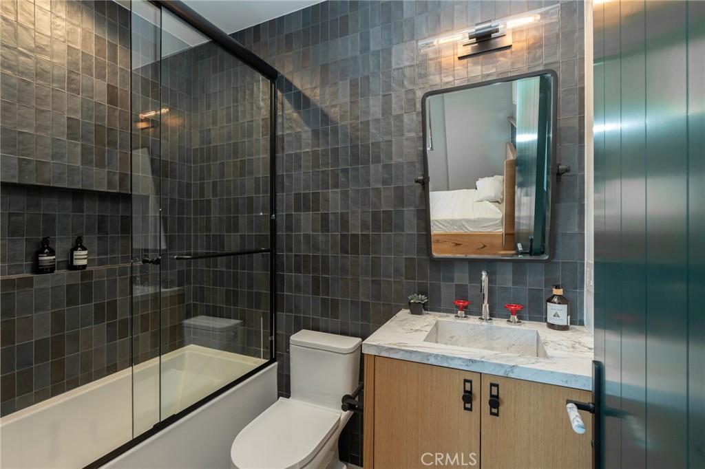 5131 Strohm Avenue Toluca Lake, CA 91601 - Photo 50 of 67 a bathroom with a sink toilet and shower