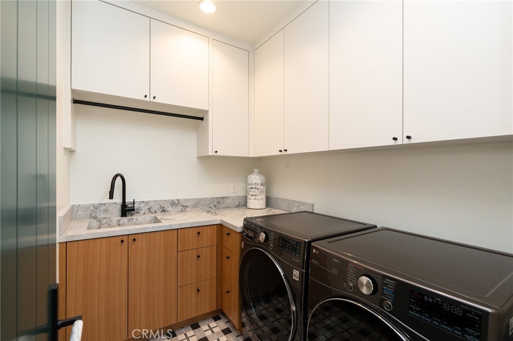 5131 Strohm Avenue Toluca Lake, CA 91601 - Photo 52 of 67 a utility room with sink dryer and washer