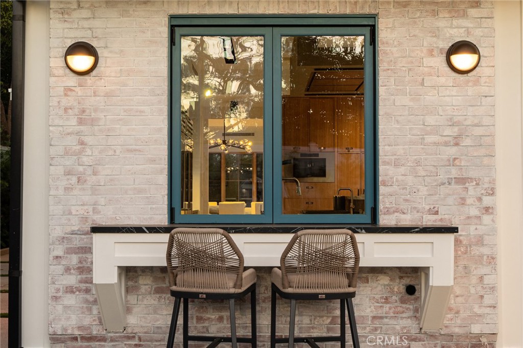 5131 Strohm Avenue Toluca Lake, CA 91601 - Photo 53 of 67 a bathroom with a granite countertop sink and a mirror
