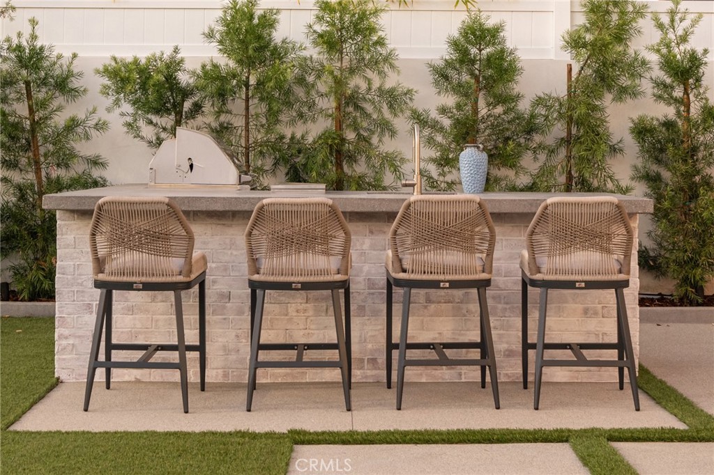 5131 Strohm Avenue Toluca Lake, CA 91601 - Photo 54 of 67 a view of a patio with table and chairs and couches