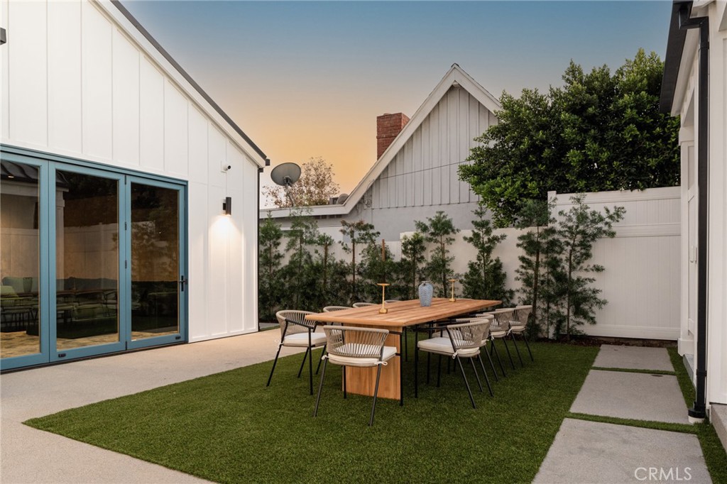 5131 Strohm Avenue Toluca Lake, CA 91601 - Photo 56 of 67 a backyard of a house with table and chairs
