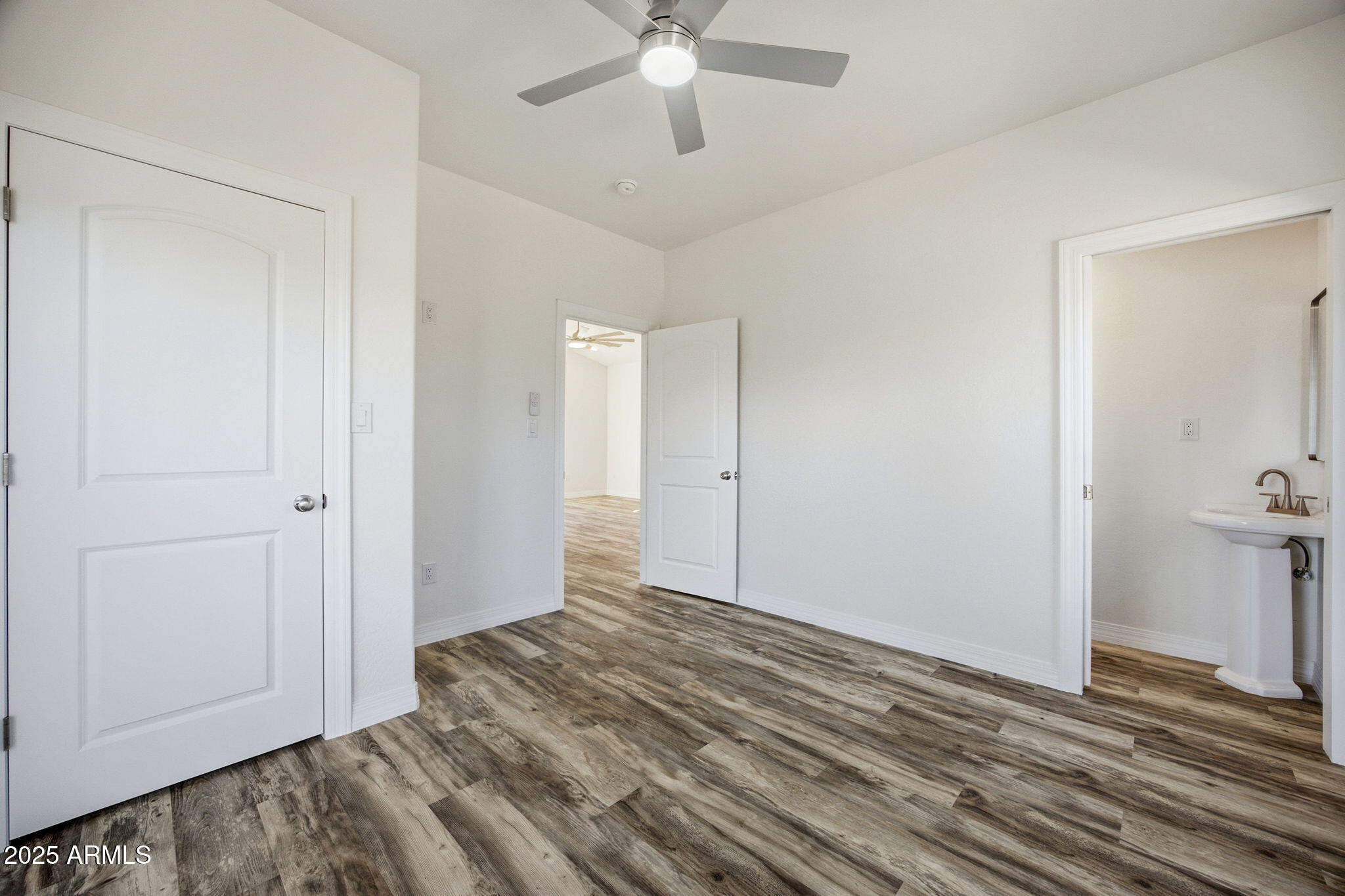 2224 Meadow Lane Overgaard, AZ 85933 - Photo 14 of 30 a view of a livingroom with wooden floor and closet area
