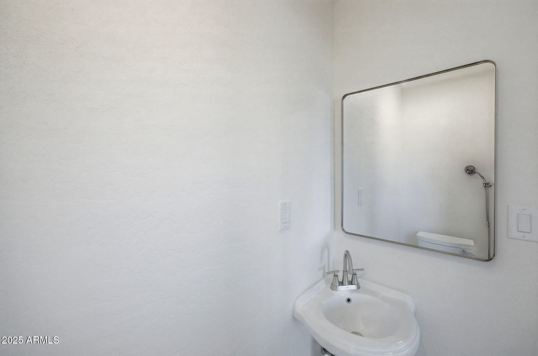 2224 Meadow Lane Overgaard, AZ 85933 - Photo 16 of 30 a bathroom with a sink and mirror
