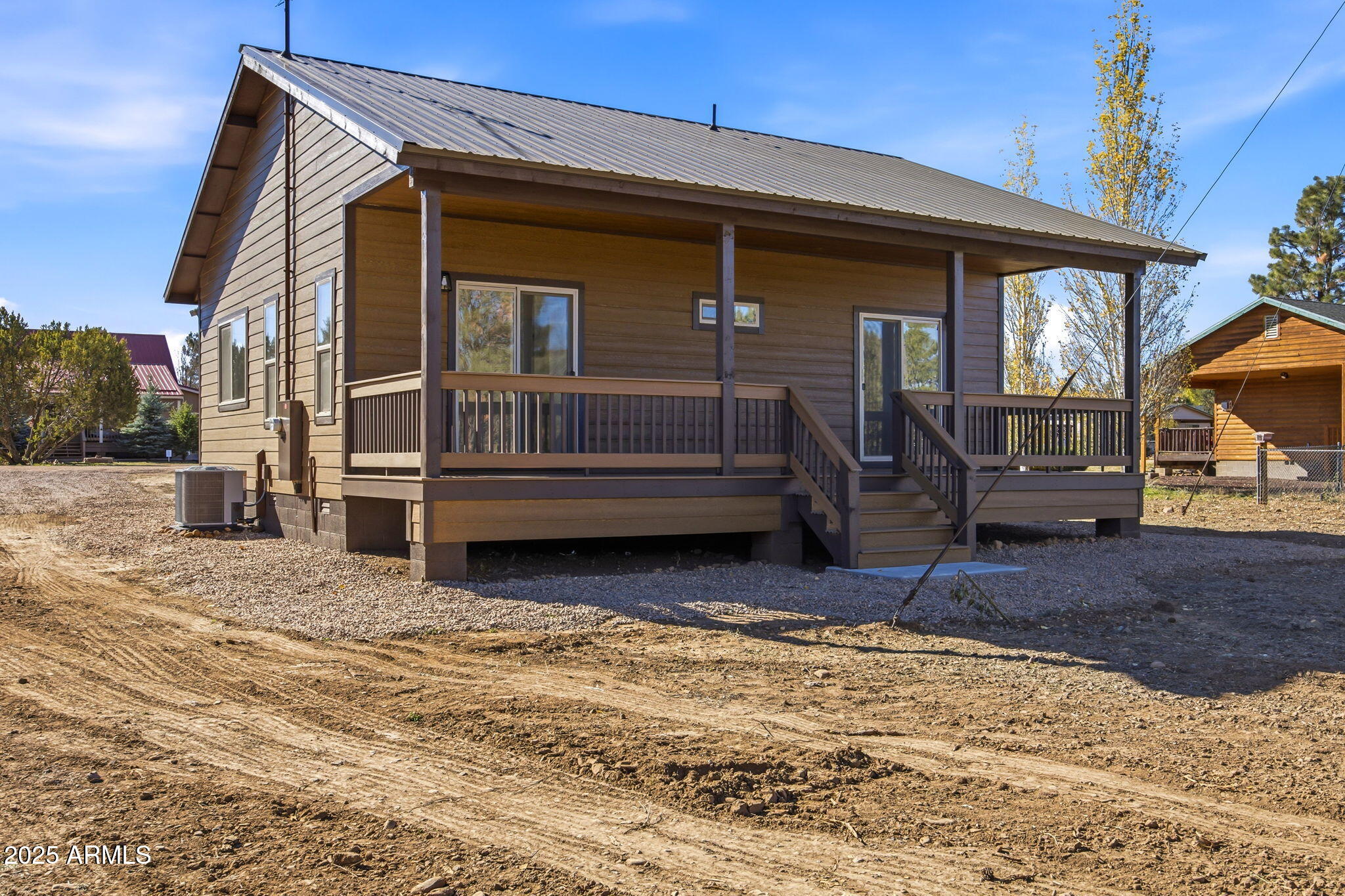 2224 Meadow Lane Overgaard, AZ 85933 - Photo 25 of 30 a view of house with wooden floor and wooden fence