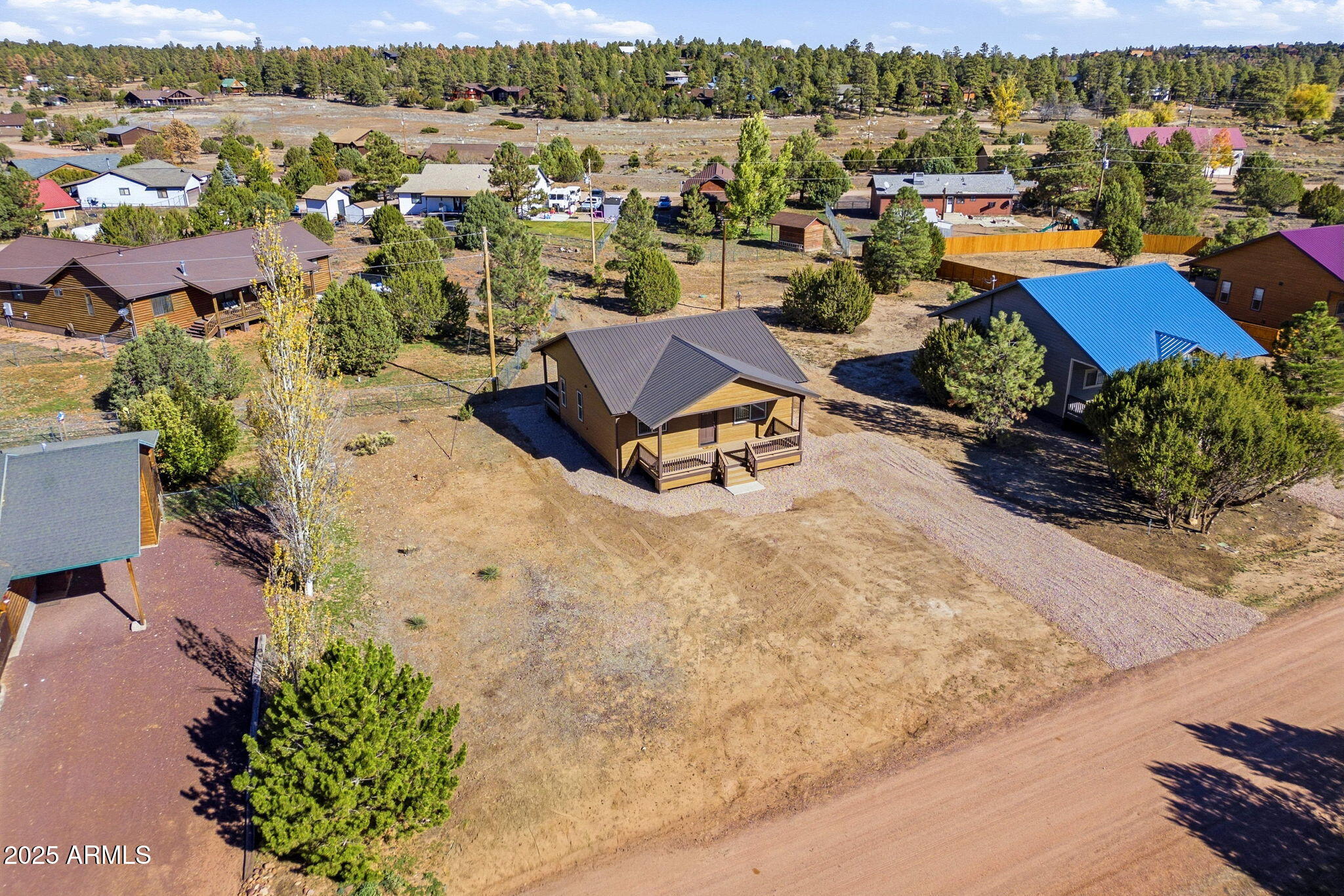 2224 Meadow Lane Overgaard, AZ 85933 - Photo 26 of 30 an aerial view of a houses with a outdoor space