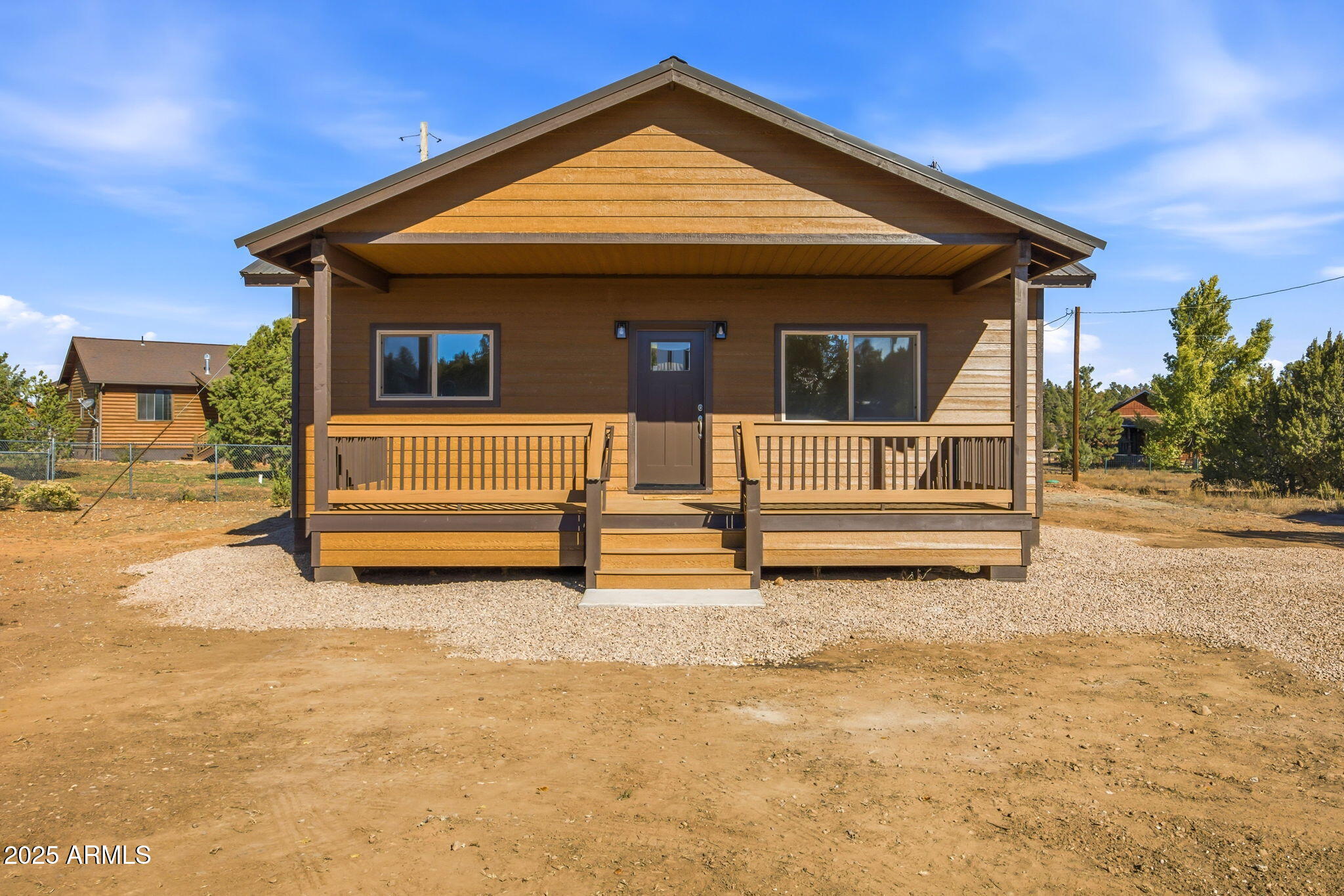 2224 Meadow Lane Overgaard, AZ 85933 - Photo 30 of 30 a view of backyard with wooden fence and a bench