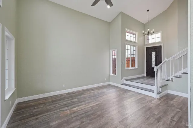 a view of entryway with stairs and wooden floor
