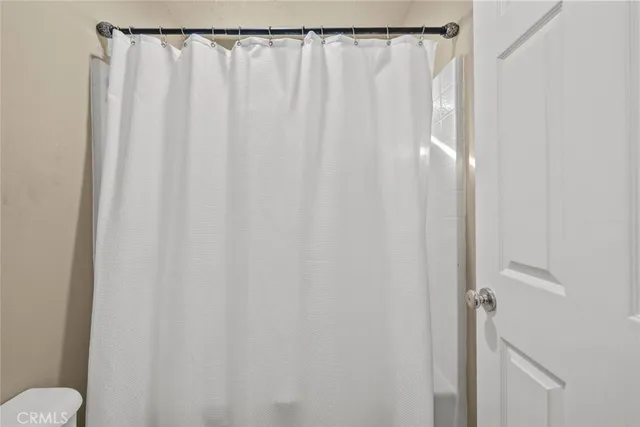 a bathroom with a shower curtain