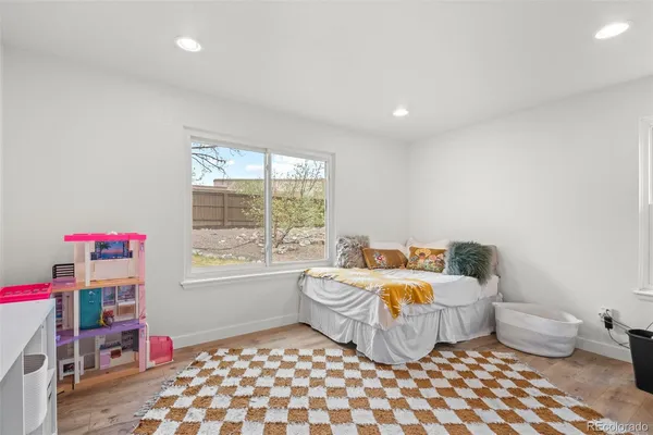 a bedroom with furniture and a window