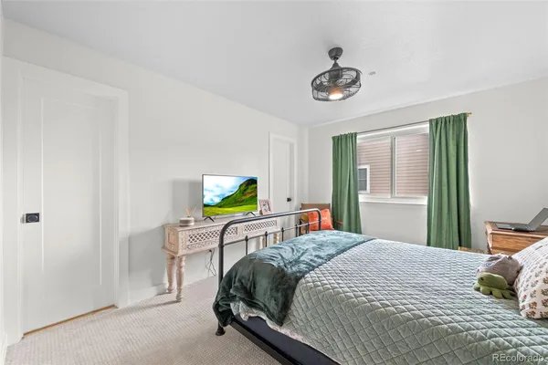 a bedroom with a bed and a table