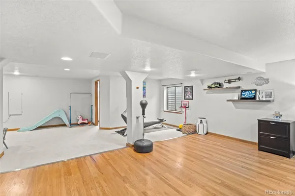 a very nice looking room with a large window and dresser