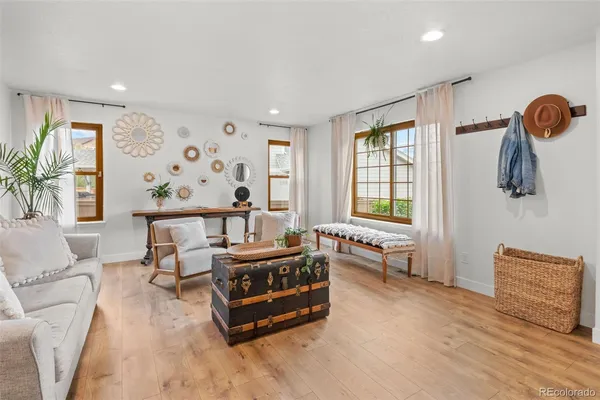 a living room with furniture and a large window