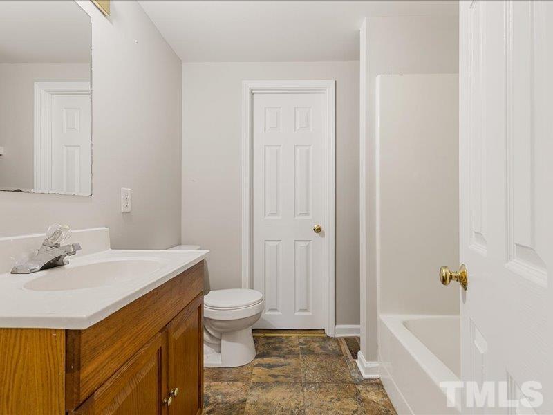 4010 Hurst Drive Franklinton, NC 27525 - Photo 13 of 32 a bathroom with a sink toilet and shower