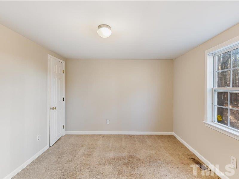 4010 Hurst Drive Franklinton, NC 27525 - Photo 14 of 32 an empty room with windows