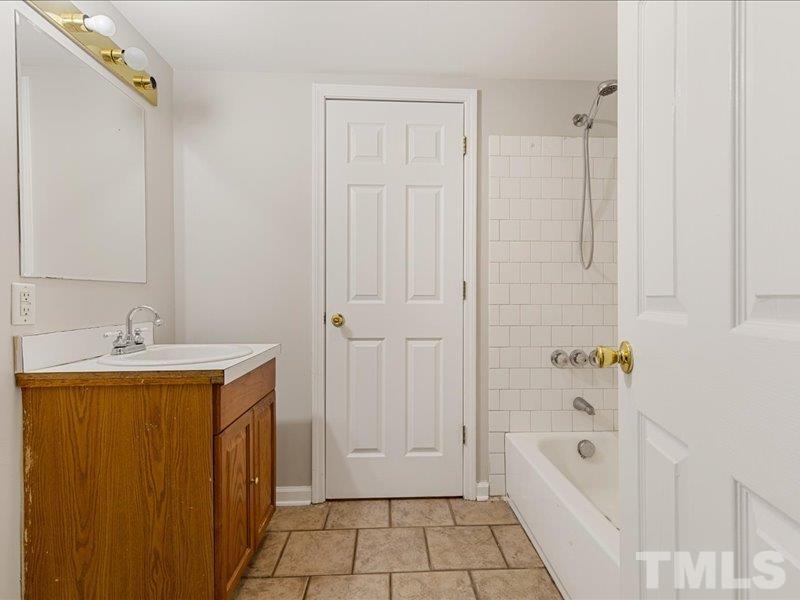 4010 Hurst Drive Franklinton, NC 27525 - Photo 18 of 32 a bathroom with a bathtub and shower