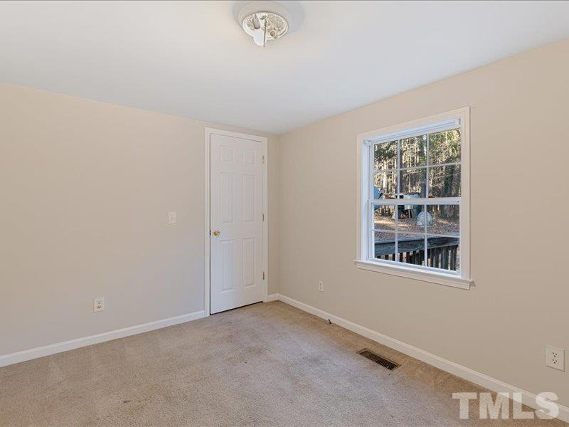 4010 Hurst Drive Franklinton, NC 27525 - Photo 21 of 32 an empty room with a window