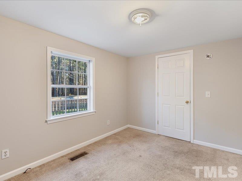 4010 Hurst Drive Franklinton, NC 27525 - Photo 22 of 32 an empty room with a window