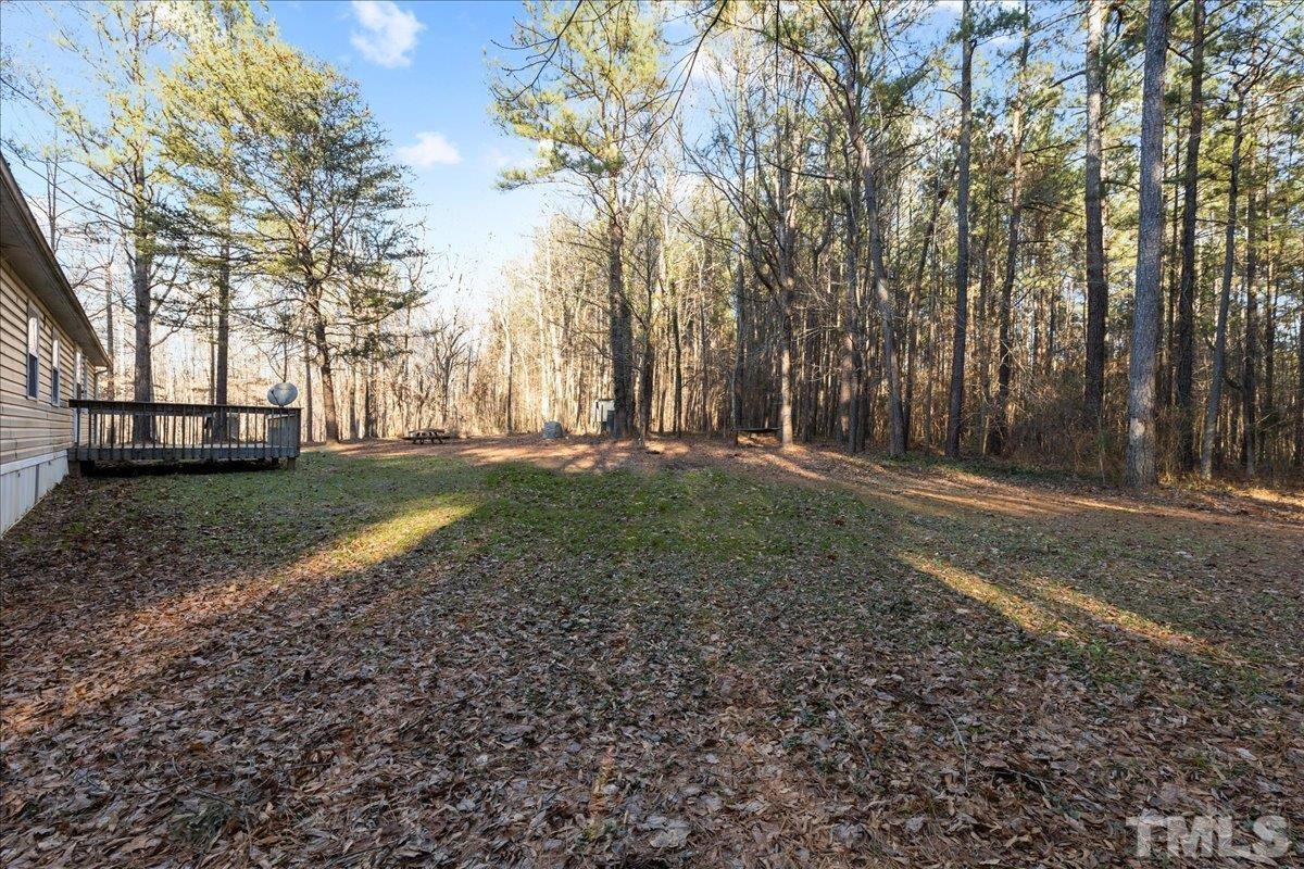 4010 Hurst Drive Franklinton, NC 27525 - Photo 31 of 32 a backyard of a house with lots of green space