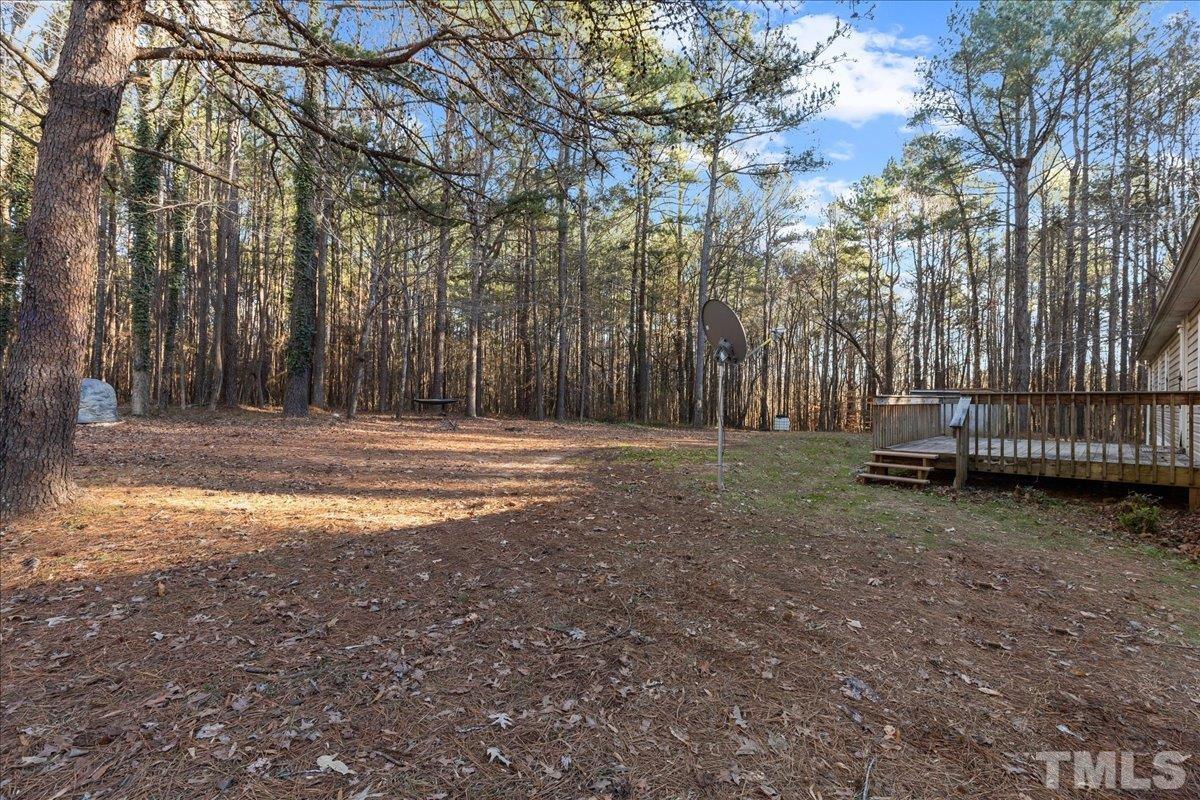 4010 Hurst Drive Franklinton, NC 27525 - Photo 32 of 32 a backyard of a house with lots of green space