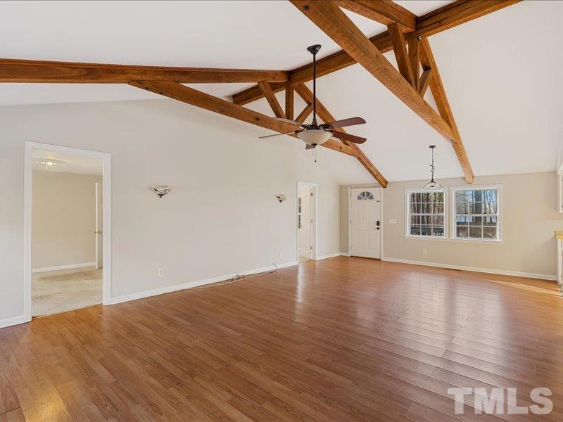 4010 Hurst Drive Franklinton, NC 27525 - Photo 5 of 32 a view of an empty room with wooden floor and white walls