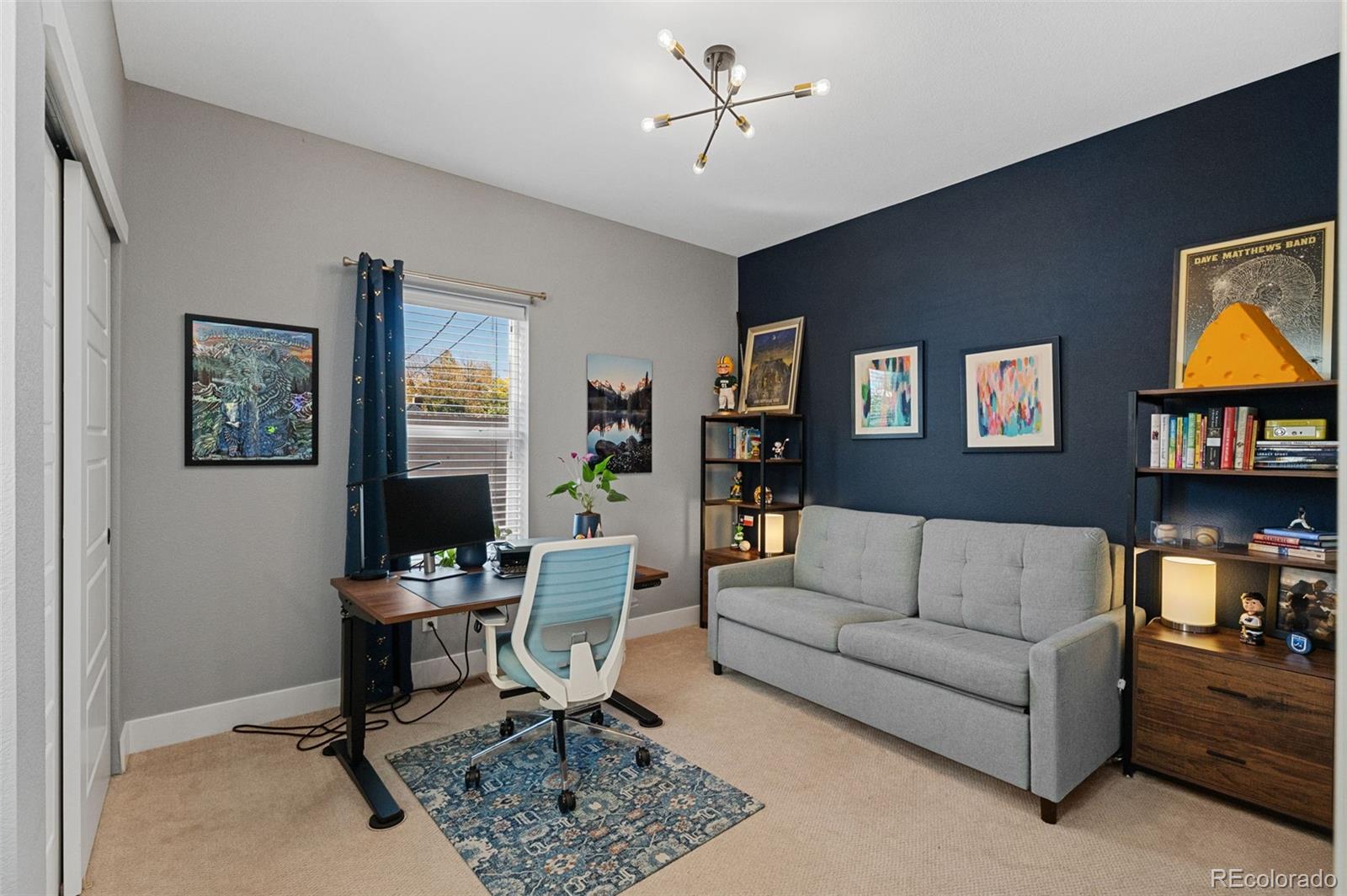 1583 South Ogden Street, Unit 1583 Denver, CO 80210 - Photo 19 of 28 a living room with furniture a rug and a window