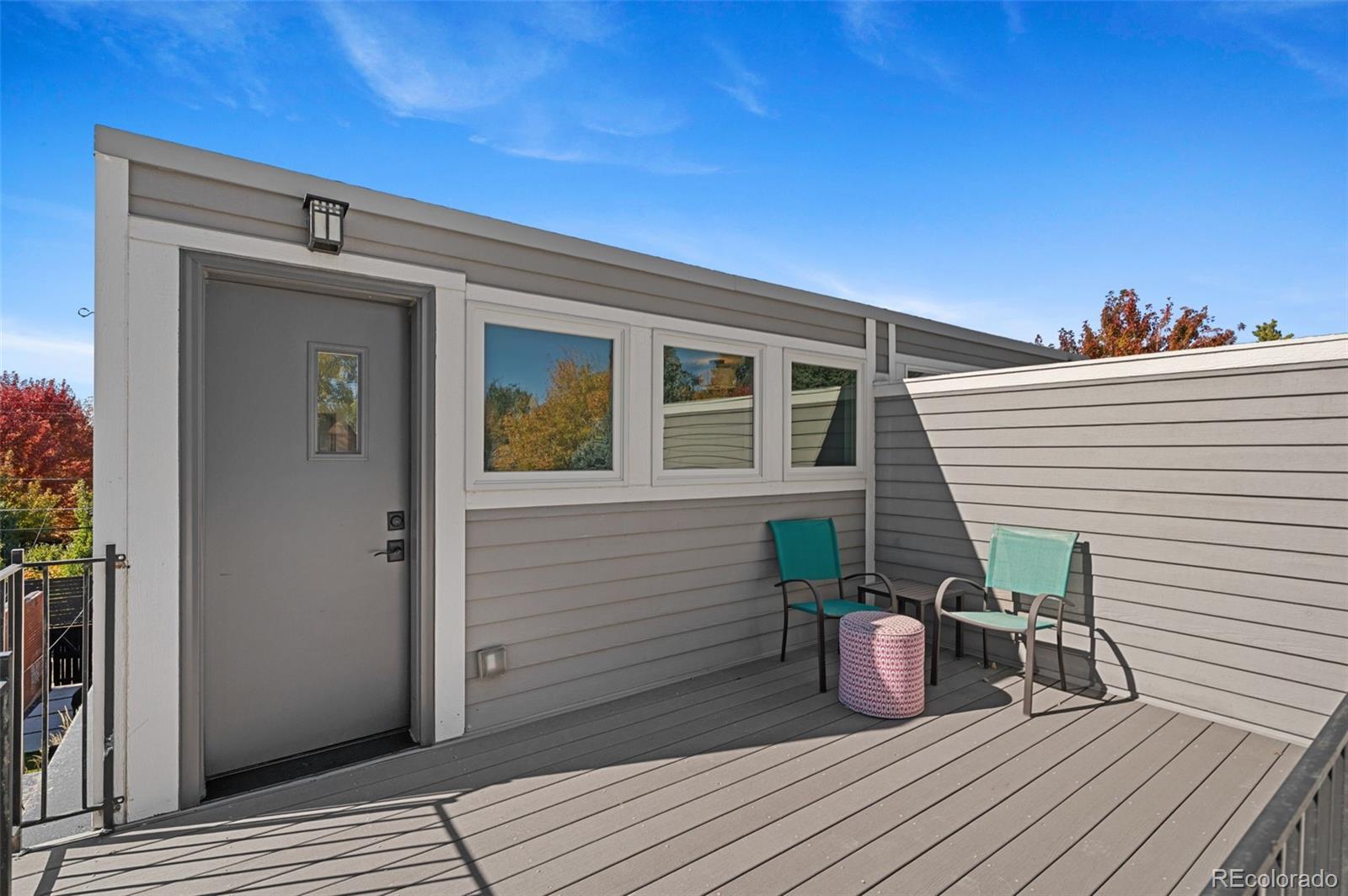 1583 South Ogden Street, Unit 1583 Denver, CO 80210 - Photo 23 of 28 a view of a deck with wooden floor and seating space