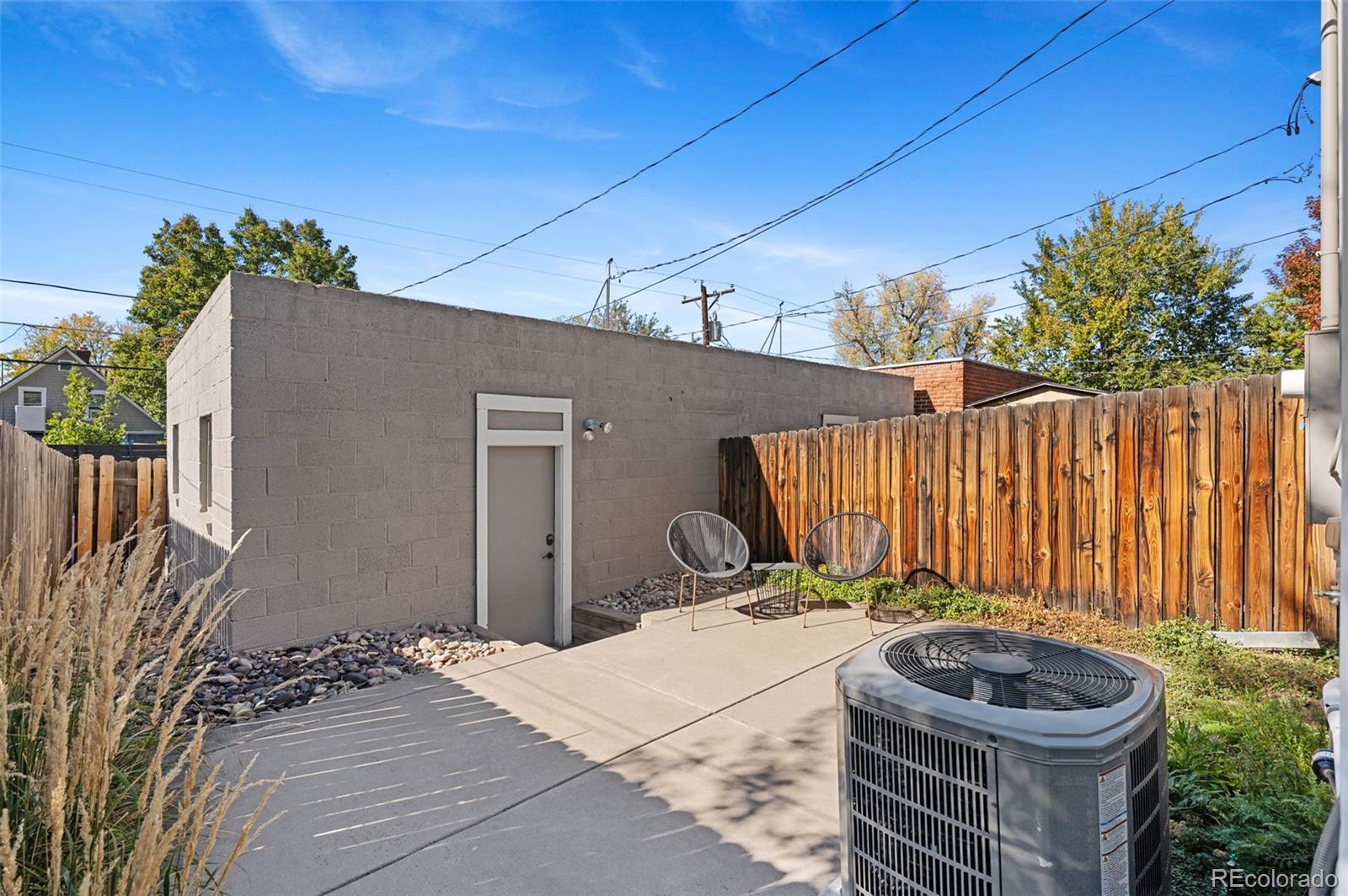 1583 South Ogden Street, Unit 1583 Denver, CO 80210 - Photo 24 of 28 a view of a backyard with a small cabin