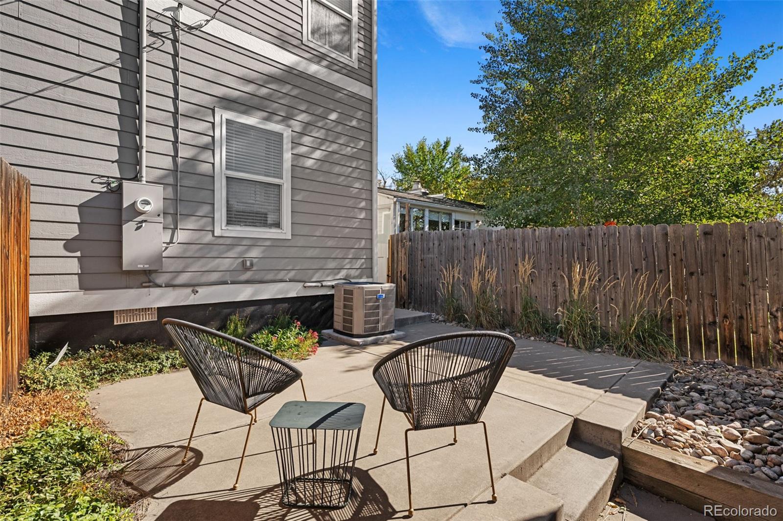 1583 South Ogden Street, Unit 1583 Denver, CO 80210 - Photo 26 of 28 a view of backyard with outdoor seating a patio and plants