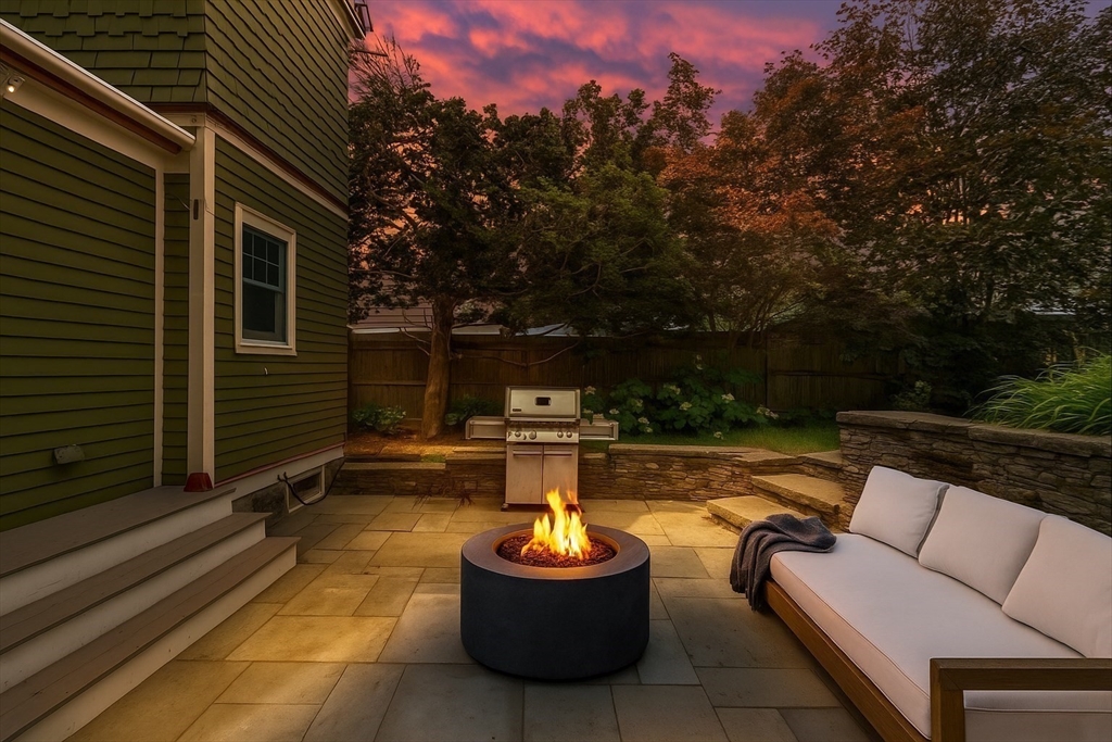 29 Dell Avenue Boston, MA 02136 - Photo 27 of 28 a view of a patio with couches chairs and a fire pit