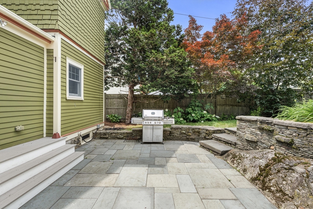 29 Dell Avenue Boston, MA 02136 - Photo 3 of 28 a backyard of a house with fountain and barbeque oven