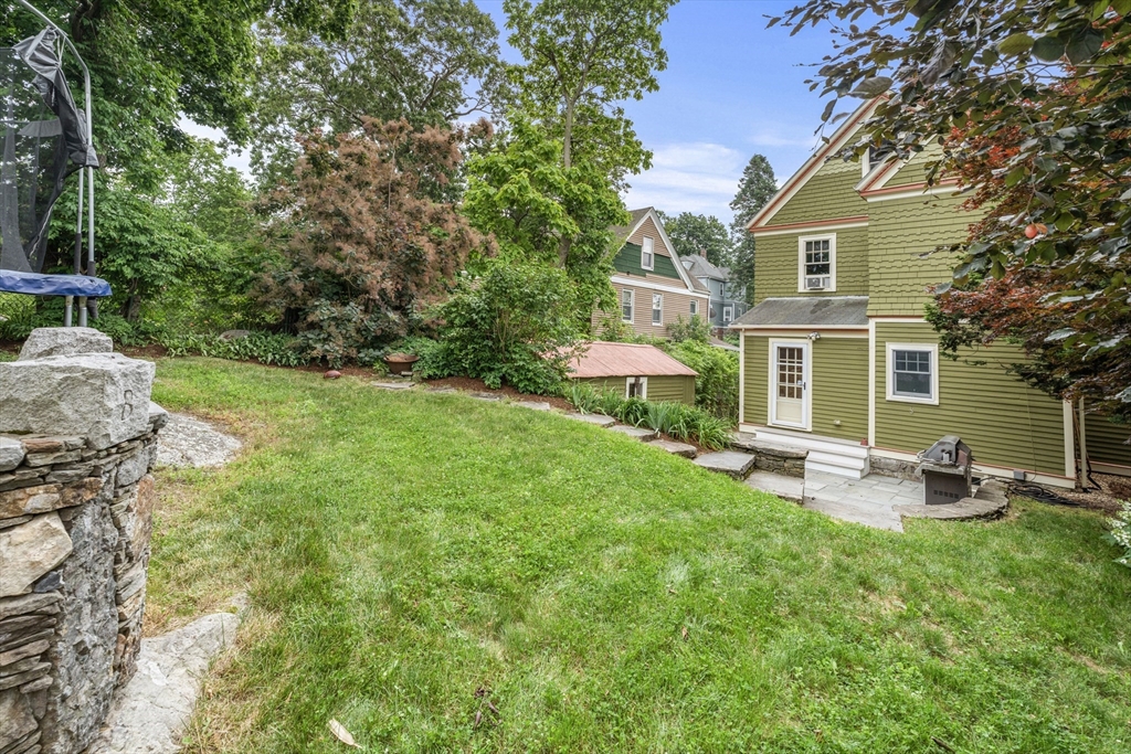 29 Dell Avenue Boston, MA 02136 - Photo 4 of 28 a front view of a house with patio and garden