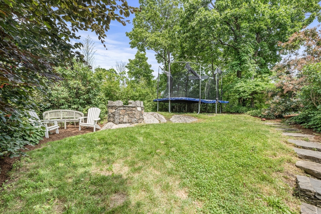 29 Dell Avenue Boston, MA 02136 - Photo 5 of 28 a backyard of a house with table and chairs
