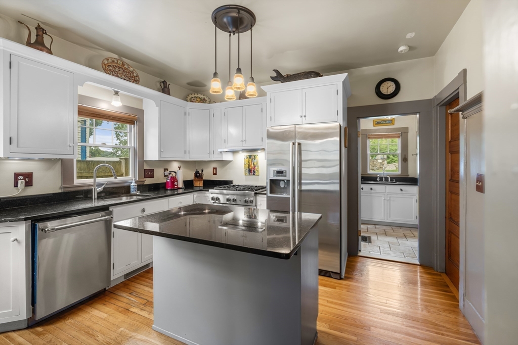 29 Dell Avenue Boston, MA 02136 - Photo 7 of 28 a kitchen with stainless steel appliances granite countertop a refrigerator a sink and a stove